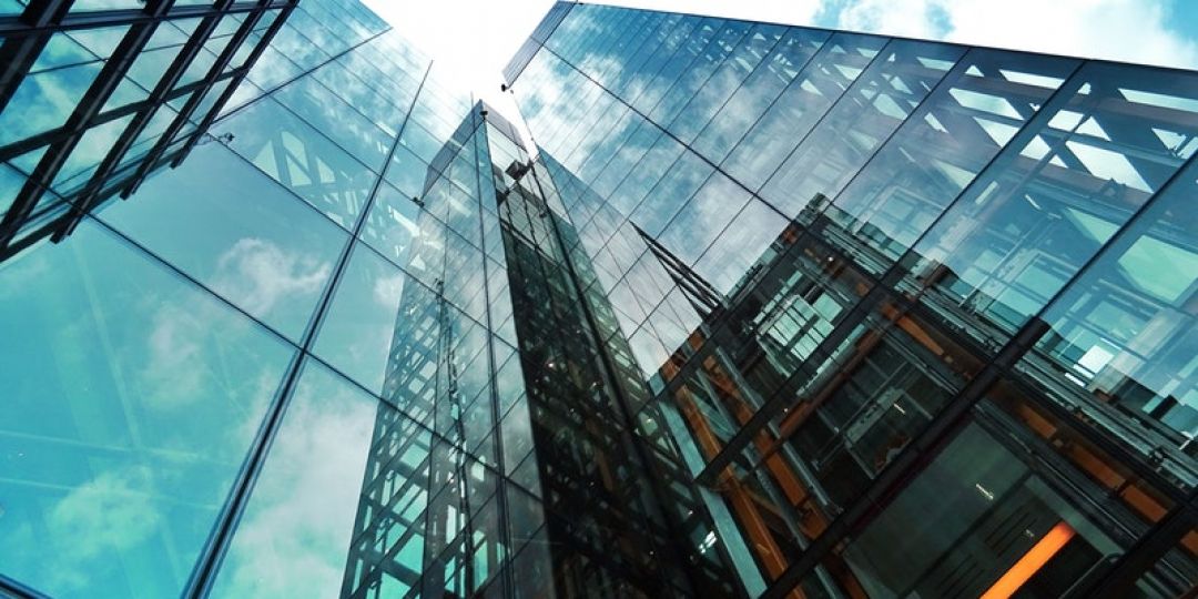 Imposing angle of corporate skyscrapers jutting into the sky 