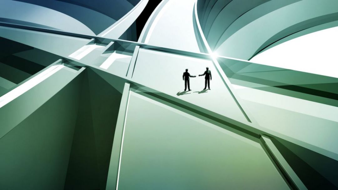 Two silhouettes of people shaking hands in cooperation on a bright road 